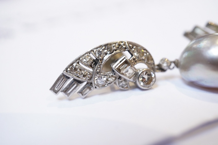 A fine pair of Art Deco natural pearl and diamond earrings, 1930s